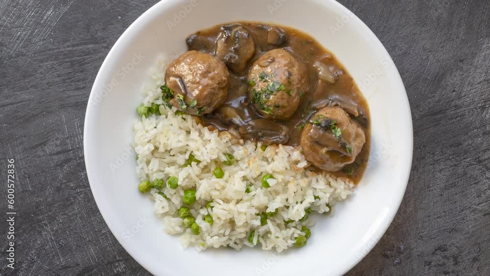 A Rotating Bowl of Meatballs with Mushroom Sauce A Rotating Bowl of Meatballs with Mushroom Sauce