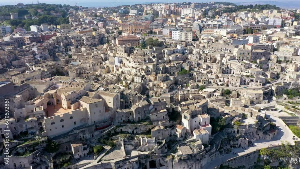 Panoramic view of the ancient town of Matera (Sassi di Matera) in a beautiful autumn day, Basilicata, southern Italy. Stunning view of the village of Matera. Matera is a city on a rocky outcrop. Panoramic view of the ancient town of Matera (Sassi di Matera) in a beautiful autumn day, Basilicata, southern Italy. Stunning view of the village of Matera. Matera is a city on a rocky outcrop.