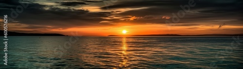A vibrant sunset over a calm ocean. Horizontal banner. AI generated © ArtStage