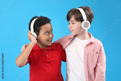 Little boys in headphones o...