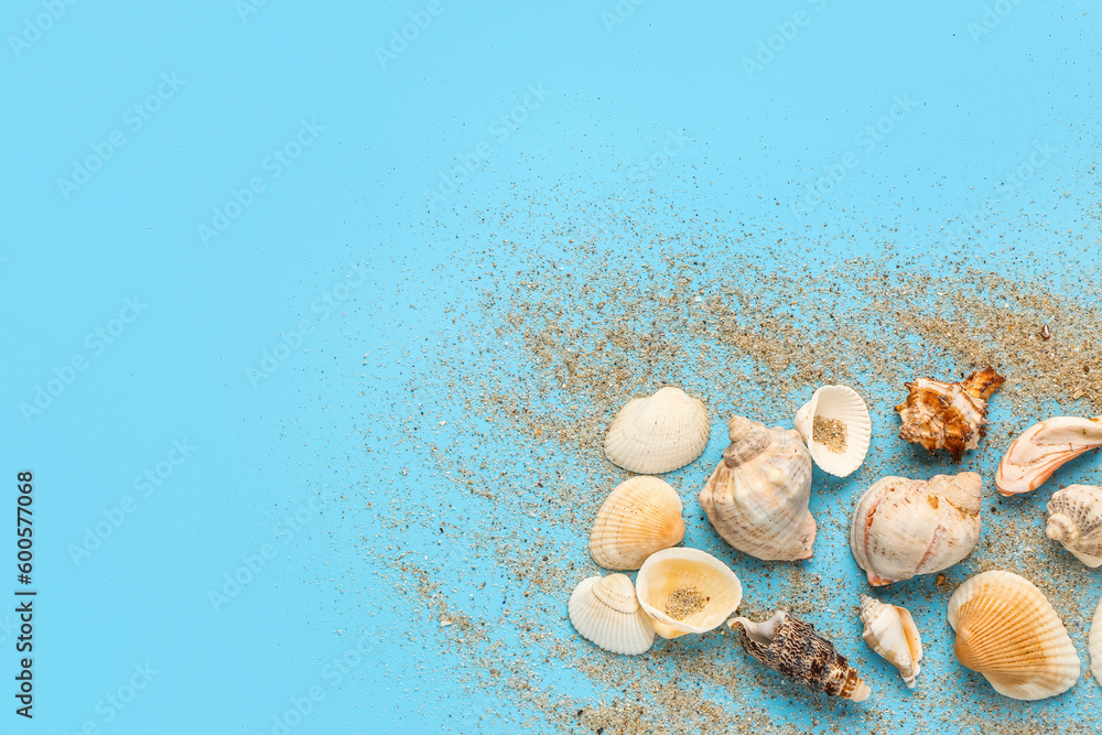 Sand and shells on blue background