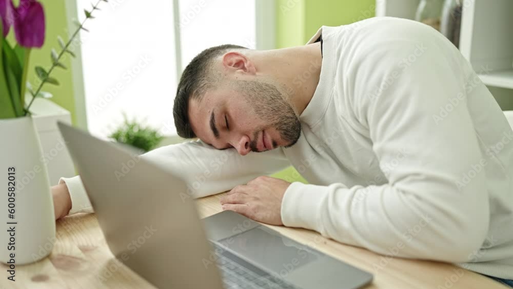 Young hispanic man sleeping on table at dinning room Young hispanic man sleeping on table at dinning room