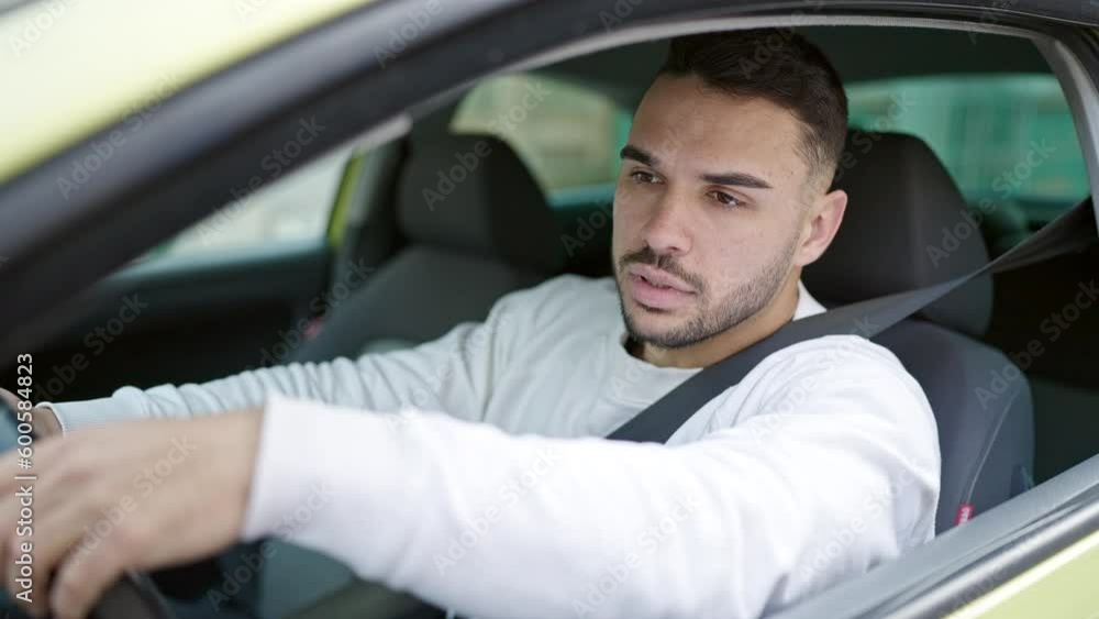 Young hispanic man angry driving car shouting at street Young hispanic man angry driving car shouting at street