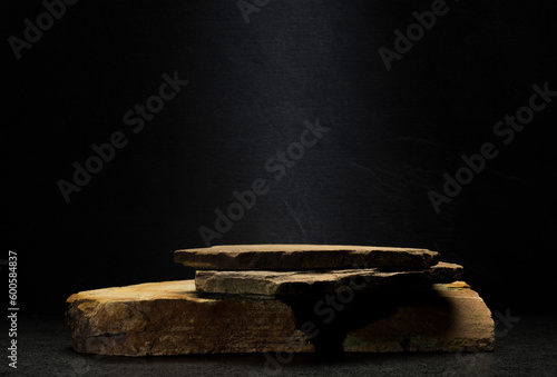 brown stones on dark gray background for podium background