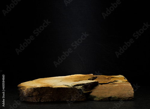 brown stones on dark gray background for podium background © serhii