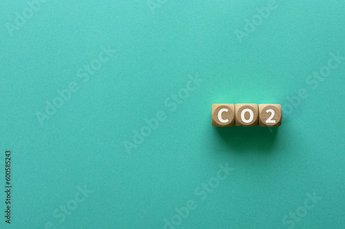 There is wood cube with the word CO2.It is as an eye-catching image.