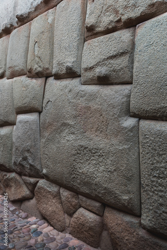 12 sided Inca Hatunrumiyoc stone, Twelve angled stone (La Piedra de Los Doce Angulos) of the ancient inca wall, Cusco, Peru photo