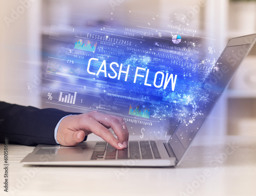 Closeup of businessman hands working on laptop