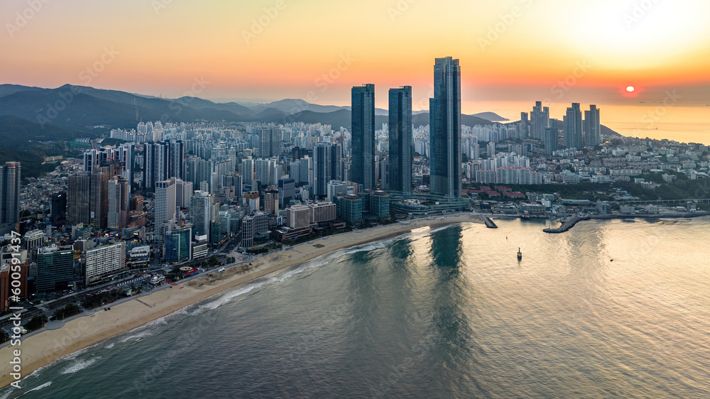 Sunrise Over Haeundae Beach and LCT The Sharp: Aerial View of Busan's Iconic Coastline