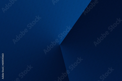 Dark blue modern background for design. Geometric shape. Triangles, diagonal lines. Gradient. Abstract.