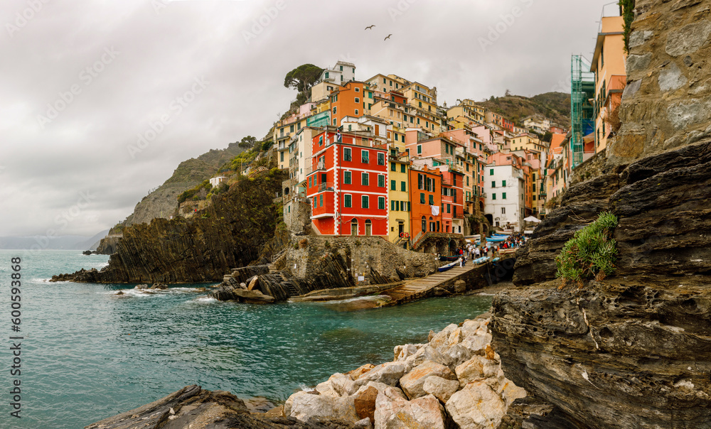 Travel to Italy: colorful houses Riomaggiore village on the cliff.