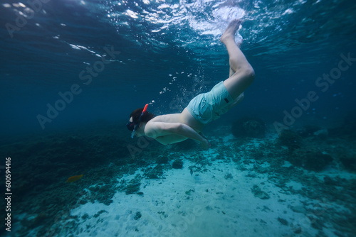 person snorkeling in the ocean