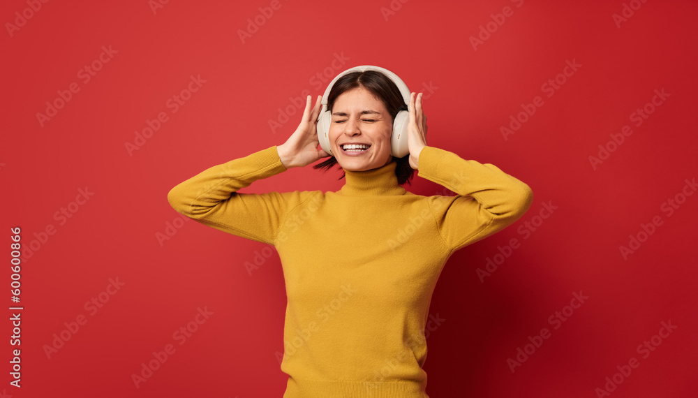 Delighted female meloman in studio Delighted female meloman in studio