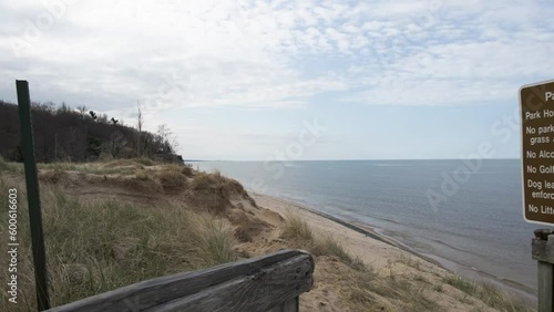 Eroding dunes in relief against the lakefront of Lake Michigan. photo