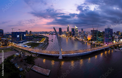 Sunset in Ba Son bridge, Saigon riveside, Ho Chi Minh city, Vietnam. Photo taken in February 2023.  photo