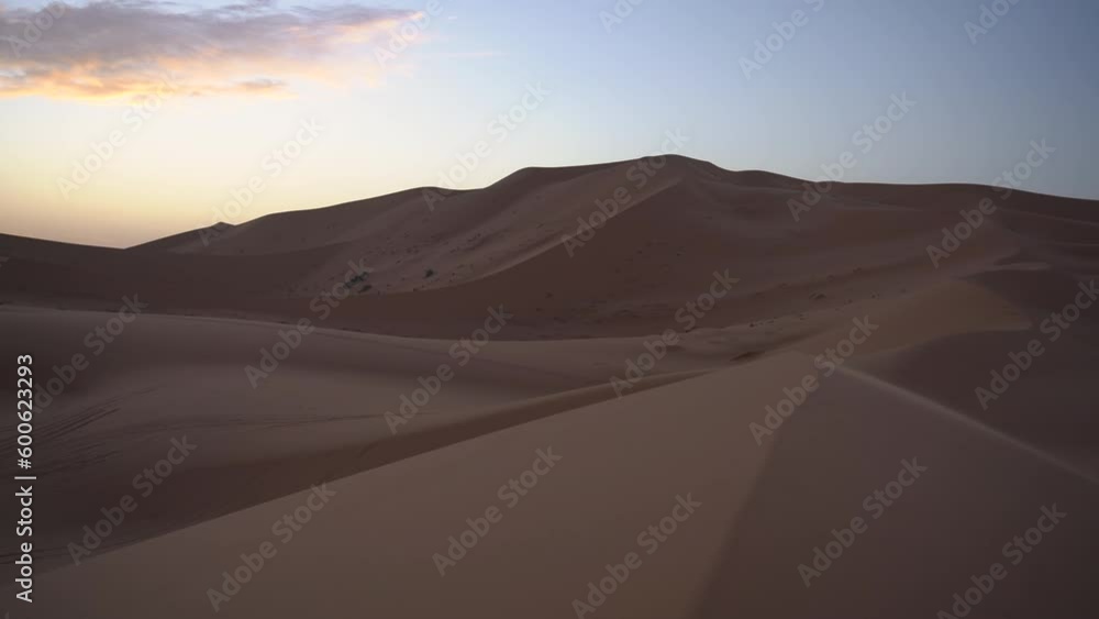 san dunes desert with colourful sunrise sand patterns with light contrast in Morocco africa san dunes desert with colourful sunrise sand patterns with light contrast in Morocco africa