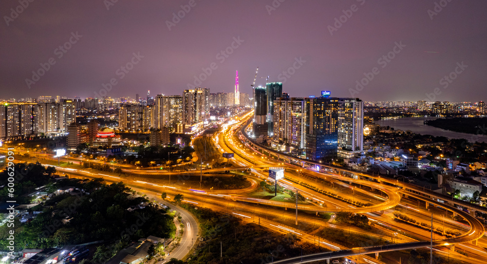 Fototapeta premium Sunset at overpass bridges in Cat Lai juntion, Ho Chi Minh city, Vietnam. Photos taken in April 2023.