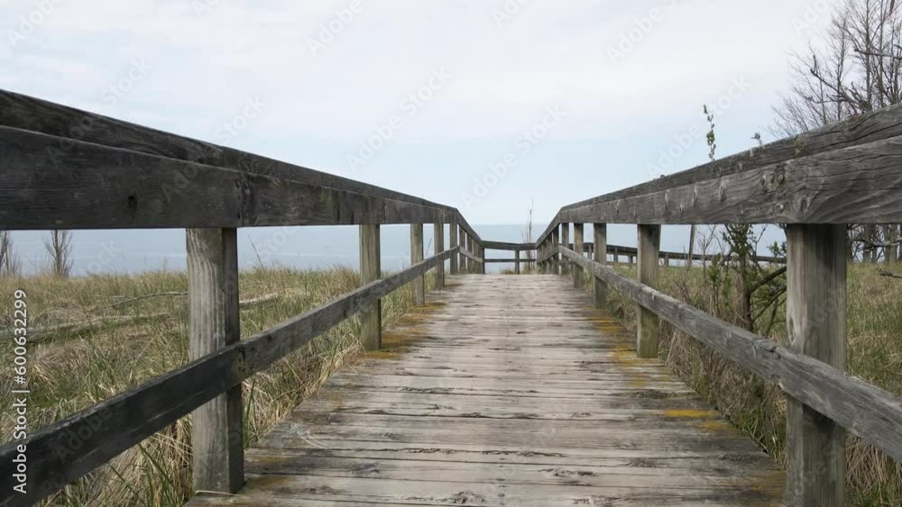 Stopping drone mid flight over boardwalk in POV. Stopping drone mid flight over boardwalk in POV.