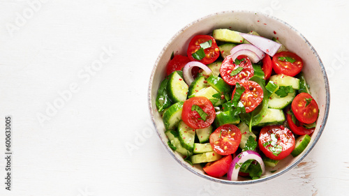 Fresh salad on light background. Top view.