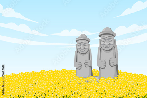 Two Dol hareubang in the middle of canola field
