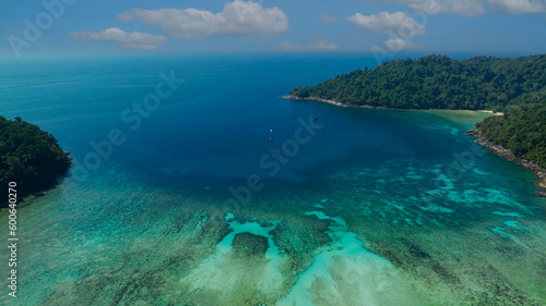  The tropical seashore island in a coral reef ,blue and turquoise sea Amazing nature landscape © SASITHORN