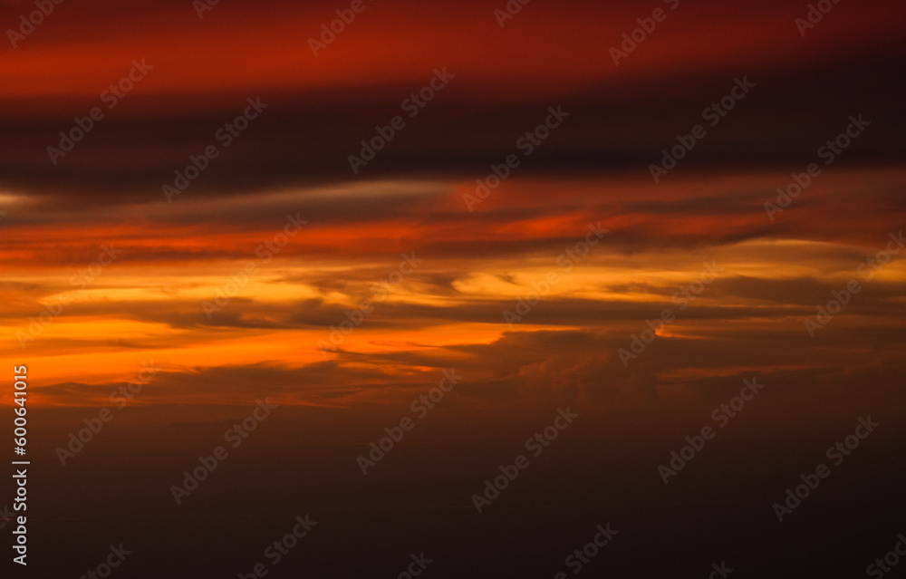 Dramatic sunset sky with orange red and blue shades. Aerial sunset landscape photo.