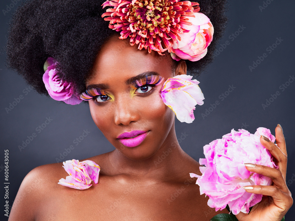 Makeup, flowers and hair with portrait of black woman for beauty, creative or spring. Natural, cosmetics and floral with face of model isolated on studio background for art, self love or confidence