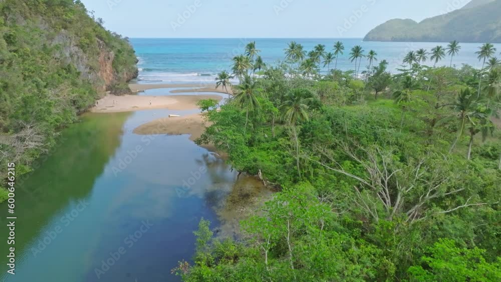 Aerial forward flight over river Río San Juan and playa el Valle during sunny day - tropical landscape in paradise Aerial forward flight over river Río San Juan and playa el Valle during sunny day - tropical landscape in paradise