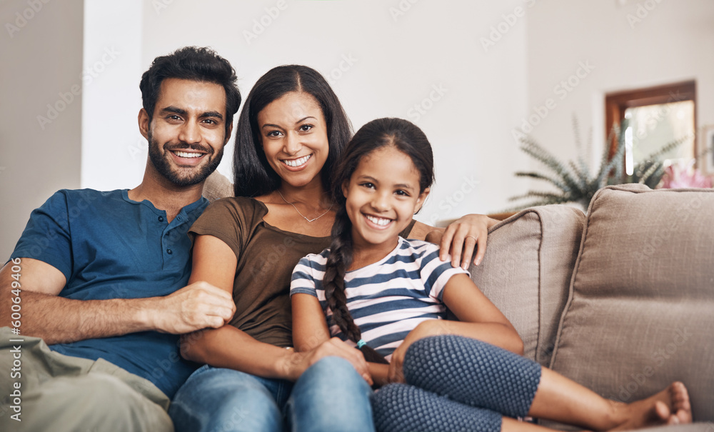 Happy family, smile and portrait on the sofa to relax, bond and sitting comfortable. Content, quality time and a mother, father and girl child on the living room couch for happiness, love and care