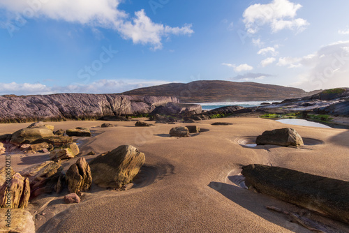Beach landscape, dunes, and rocks on the Ring of Kerry in Ireland.
