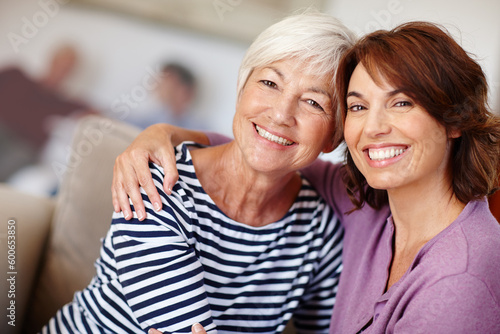 Woman, grandmother and hug portrait in home with family, care and parent love or smile. Happiness on face, retirement and adult with elderly mom, embrace together on couch and living room