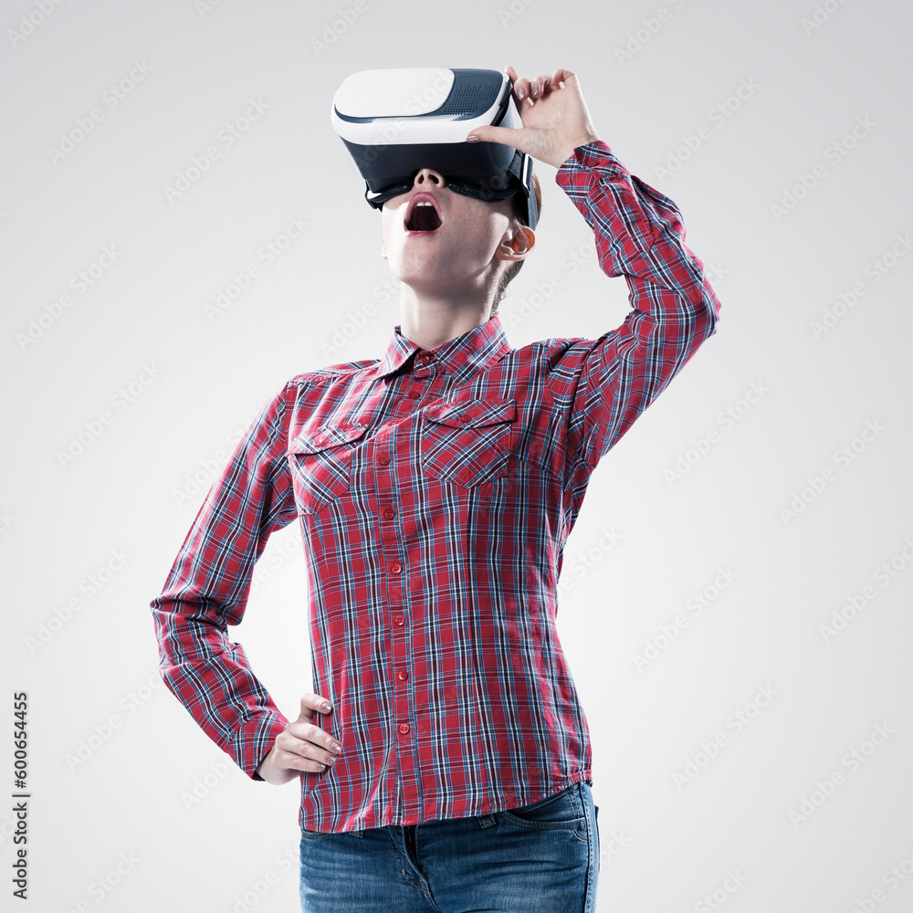 Fototapeta premium Girl in mask experiencing virtual reality as new entertainment device