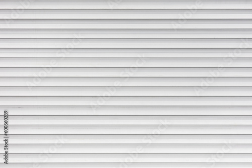 White metal roller shutter door texture background. Texture of white metal roller shutter door