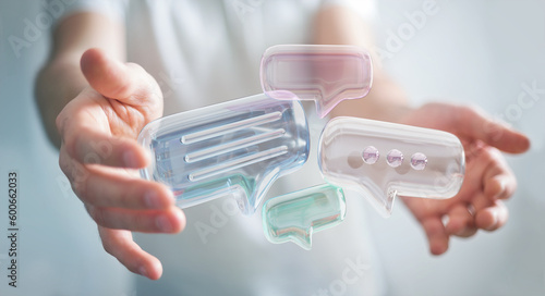 Businessman holding digital speech bubbles talk icons. Minimal conversation or social media messages floating between man hands. 3D rendering
