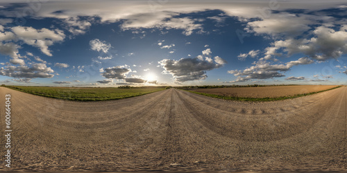 panorama 360 hdri on gravel road with evening clouds on blue sky before sunset in equirectangular spherical seamless projection, use as sky replacement in drone panoramas, game development as sky dome