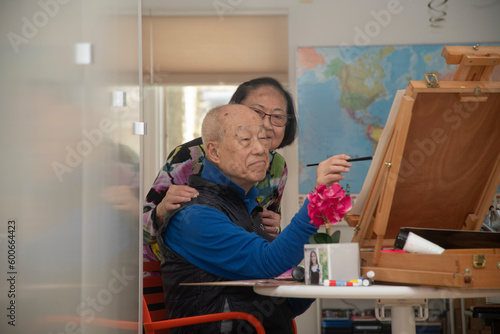 Senior retiree painting in the afternoon photo