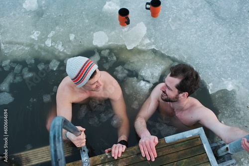 two male friends taking a cold water dip in the Baltic Sea