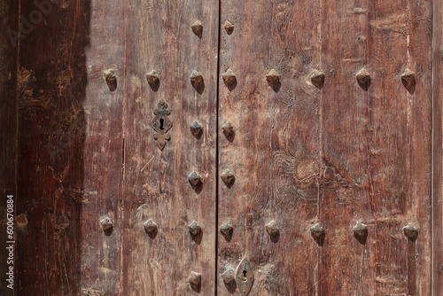 Traditional wooden door decorated with iron nails, Malta