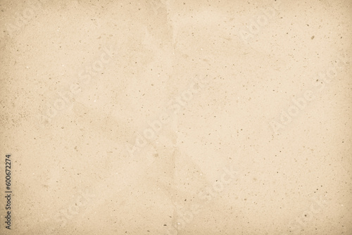 Brown recycled craft paper texture as background. Cream paper texture, Old vintage page or grunge vignette. Pattern rough art creased grunge letter. Hardboard with copy space for text.
