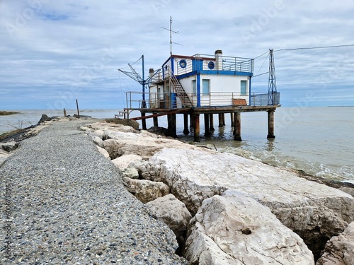 Fishing shack or fishing hut or fishing cabin on pier of Adriatic sea in Italy, Europe