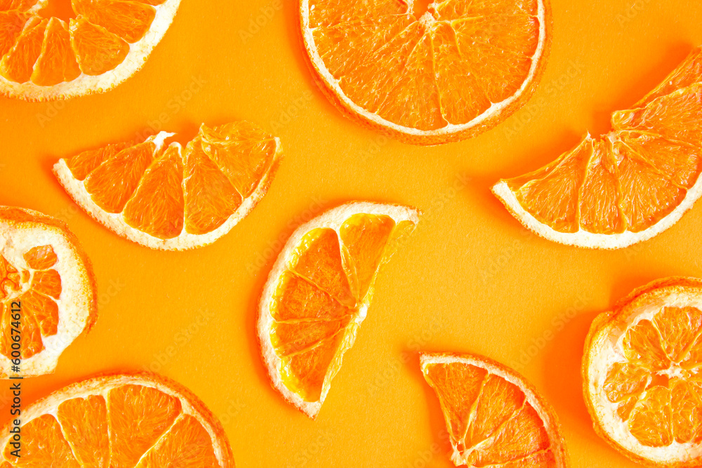 Orange chips on an orange background, top view. A healthy snack. Orange chips on an orange background, top view. A healthy snack.
