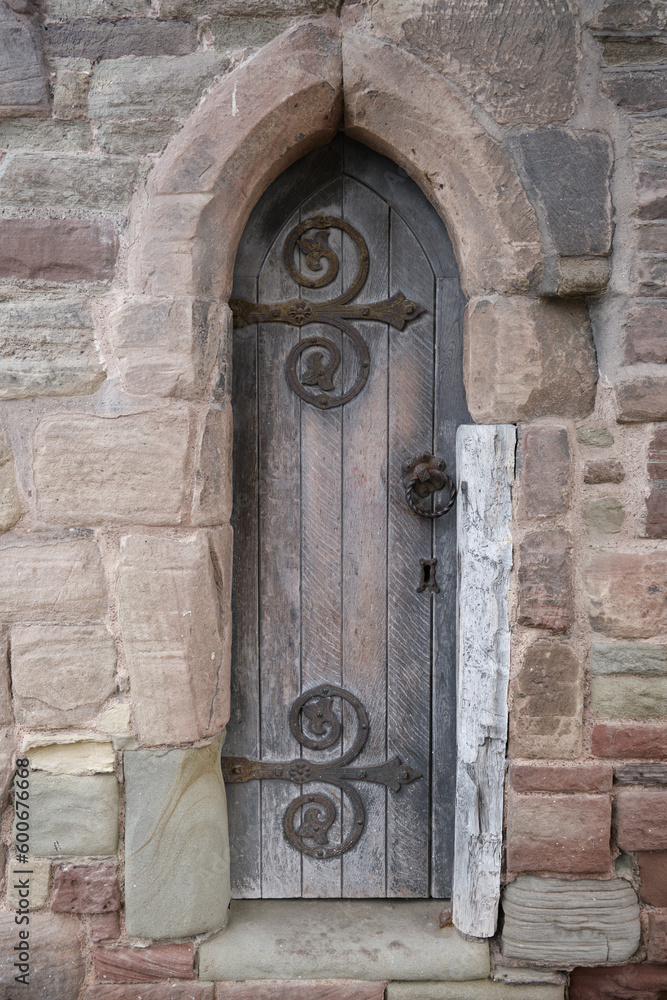 Historical wooden door at the entrance to The Wye Bridge, Monmouth, Monmouthshire, Wales.