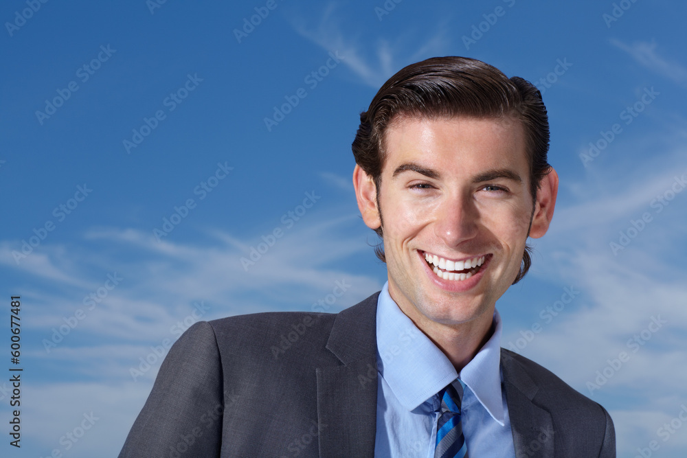 Portrait, smile and happy man outdoors for business travel against a blue sky background. Face, empowered and businessman person excited while traveling, laughing and cheerful, confident and free Portrait, smile and happy man outdoors for business travel against a blue sky background. Face, empowered and businessman person excited while traveling, laughing and cheerful, confident and free