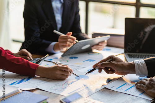 Fototapeta Naklejka Na Ścianę i Meble -  Asian Business Advisory Conference to analyze and discuss the situation in financial reports in the conference room. Investment Advisor, Thanakharn Loan and Group Working Accounting Concepts