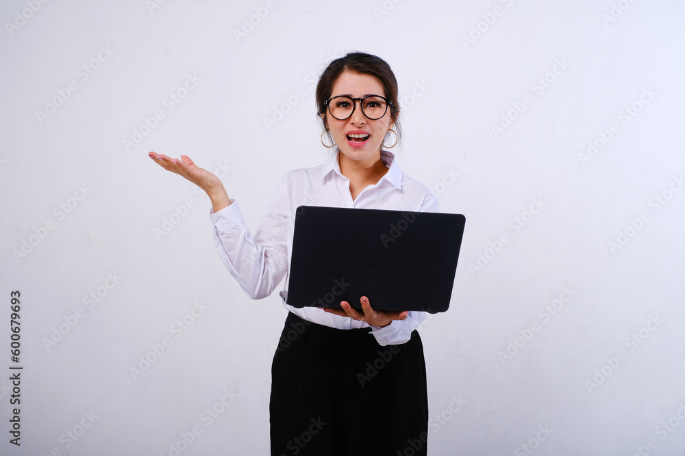 Photo of confused or shocked Asian businesswoman hold laptop and open palm, rejection concept on empty space or copy space for product isolated on white background