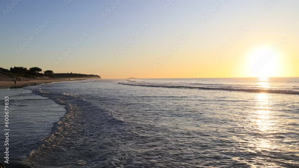 Long wide Caves beach at sunrise on Pacific coast in Australia 4k.
Long wide Caves beach at sunrise on Pacific coast in Australia 4k.