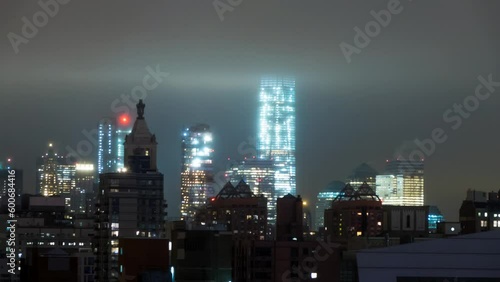 Wallpaper Mural Lockdown Time Lapse Shot Of Street Amidst Illuminated One World Trade Center Under Clouds Amidst Buildings In Modern City At Night - New York City, New York Torontodigital.ca