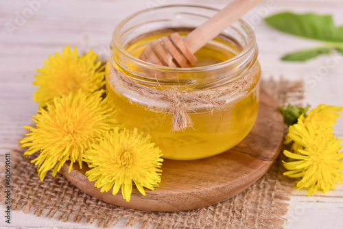 Fresh honey from spring dandelions in a jar. Close-up. 