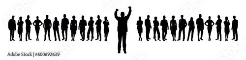 Businessman raising hands standing foreground with his business team at background silhouette.
