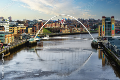 Gateshead Millennium Bridge crossing River Tyne in Gateshead, with a view of Newcastle upon Tyne, UK © atosan